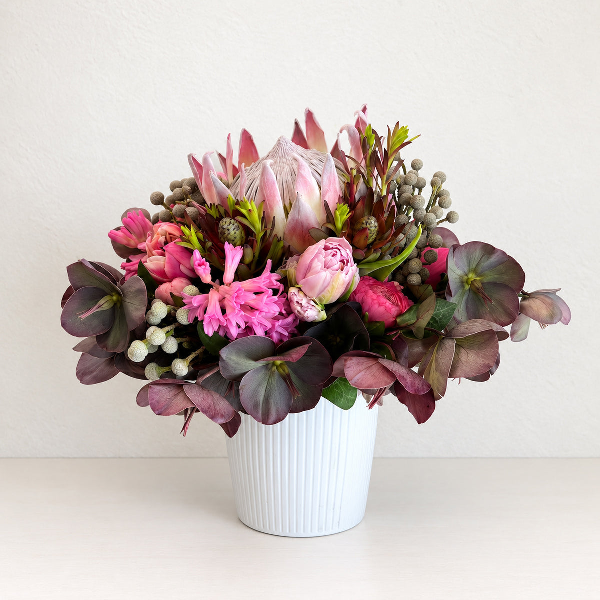 Seasonal Arrangement in Signature Ceramic Vase