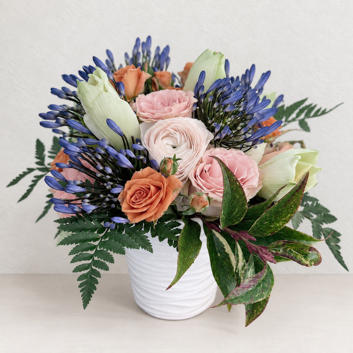 Seasonal Arrangement in Signature Ceramic Vase