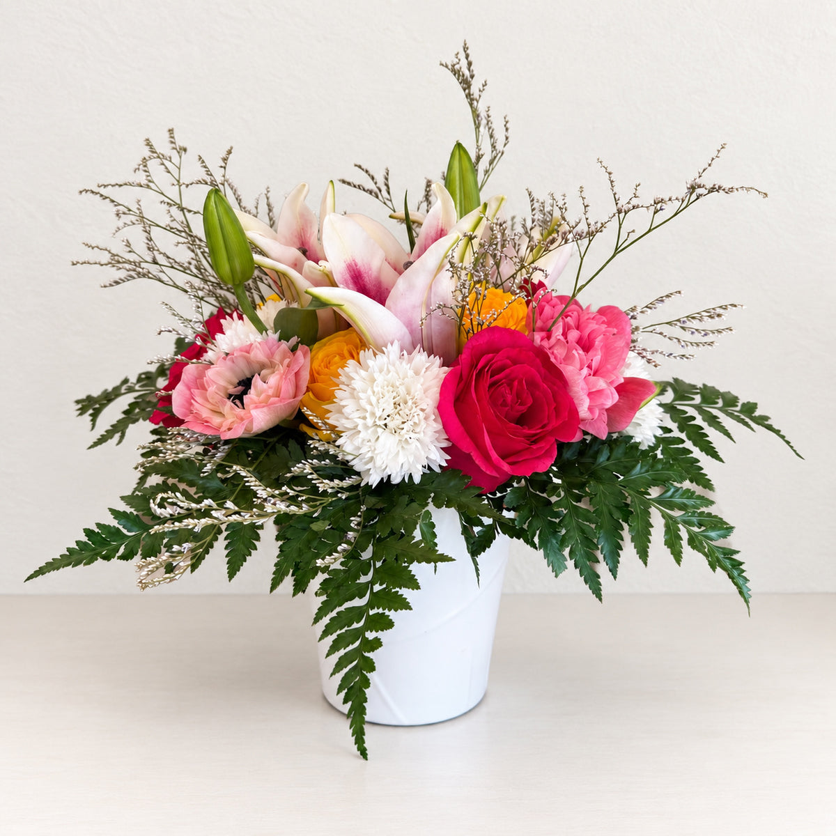 Seasonal Arrangement in Signature Ceramic Vase